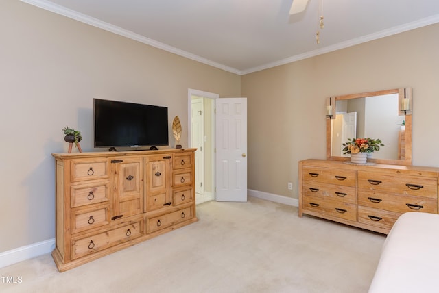 bedroom featuring ceiling fan, crown molding, baseboards, and light carpet