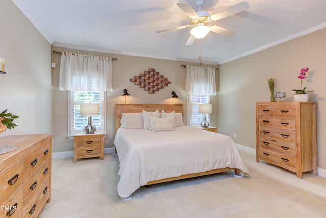 bedroom featuring ceiling fan, ornamental molding, baseboards, and light carpet