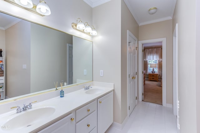 full bath featuring double vanity, ornamental molding, baseboards, and a sink