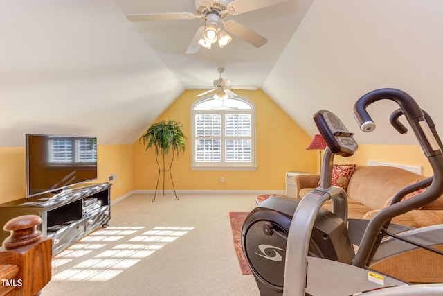 exercise room with carpet flooring, baseboards, a ceiling fan, and vaulted ceiling