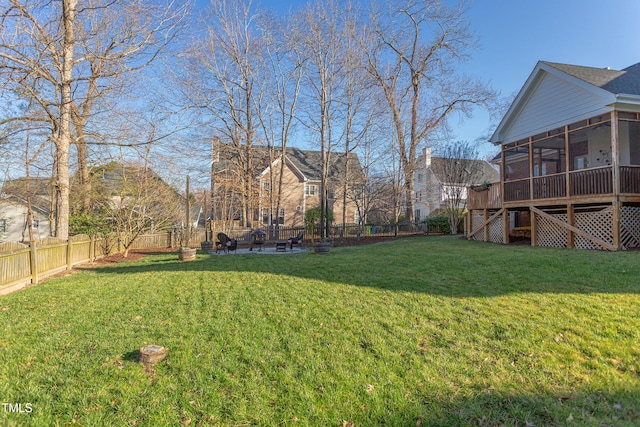 view of yard with a patio, a fenced backyard, stairs, and a sunroom