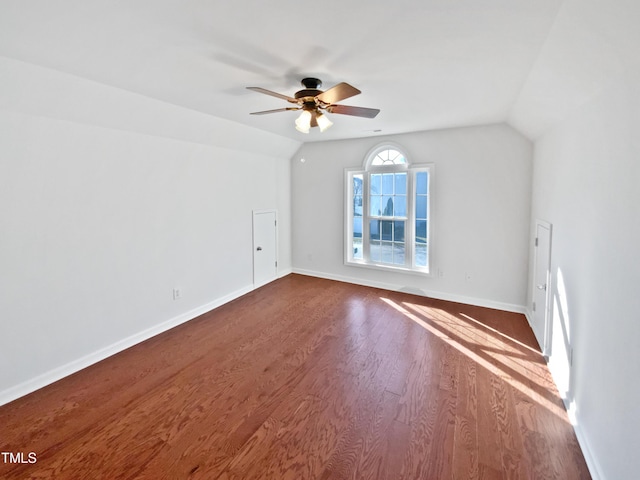 bonus room featuring lofted ceiling, ceiling fan, wood finished floors, and baseboards