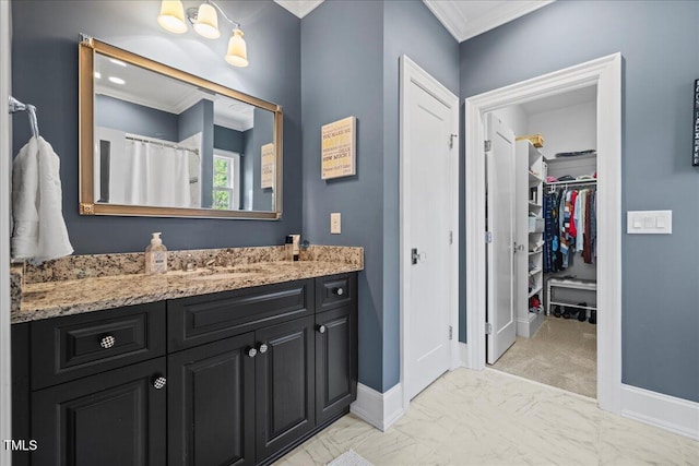 full bathroom featuring ornamental molding, marble finish floor, vanity, and baseboards