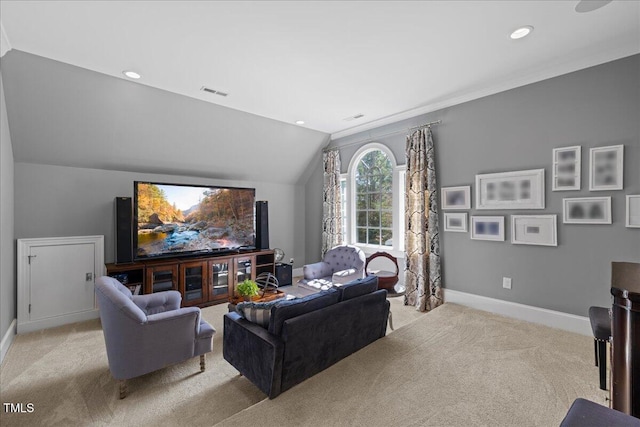 home theater with lofted ceiling, recessed lighting, light carpet, visible vents, and baseboards