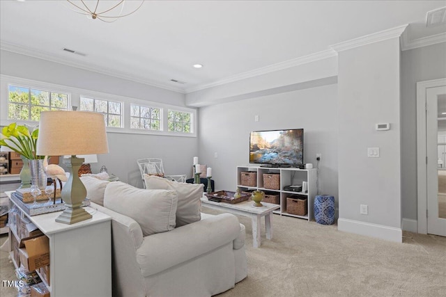 carpeted living area with a healthy amount of sunlight, visible vents, crown molding, and baseboards