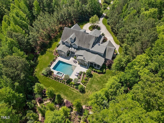 drone / aerial view featuring a view of trees