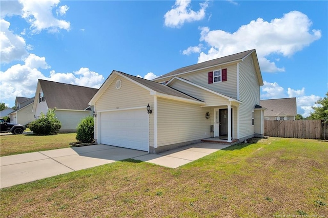 traditional home featuring a garage, concrete driveway, fence, and a front lawn