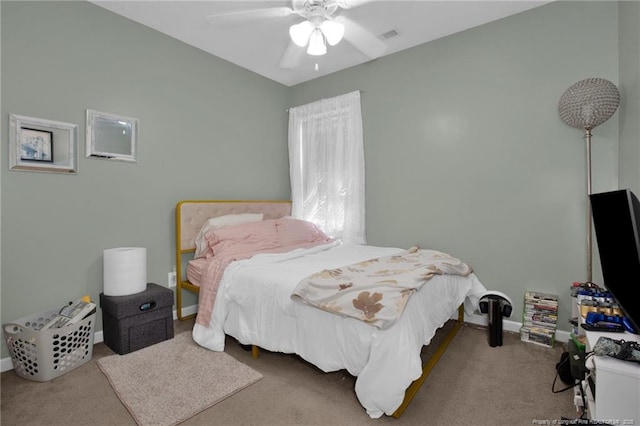 bedroom featuring carpet floors, ceiling fan, and baseboards