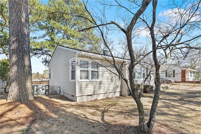 view of property exterior with crawl space