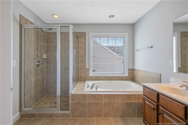 full bath featuring tile patterned floors, a shower stall, vanity, and a bath