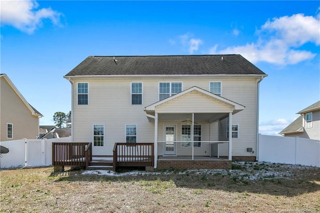 rear view of property with ceiling fan, a patio, a lawn, and a fenced backyard