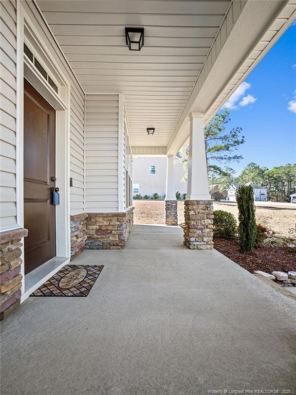 view of patio featuring a porch