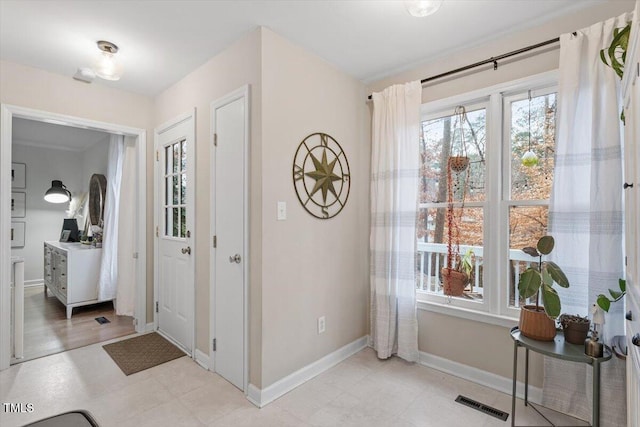 entrance foyer with visible vents and baseboards