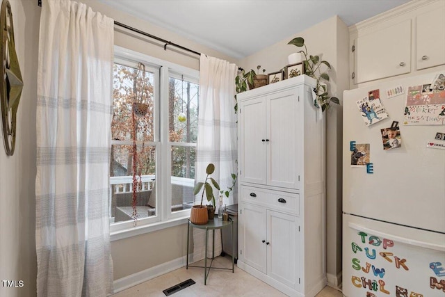 interior space with visible vents and baseboards