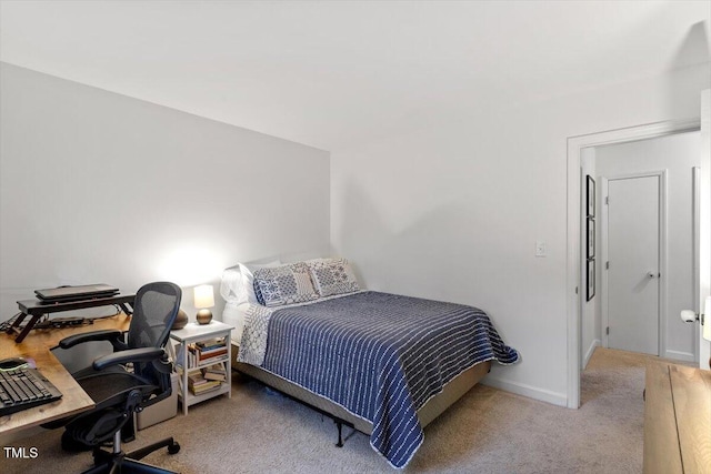 bedroom featuring carpet flooring and baseboards