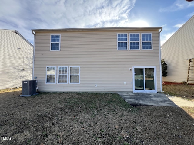 back of house with a lawn, a patio, and central AC unit