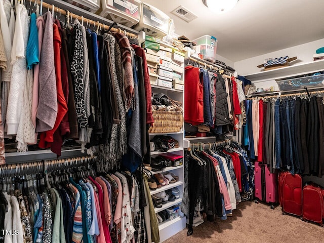 spacious closet with carpet and visible vents