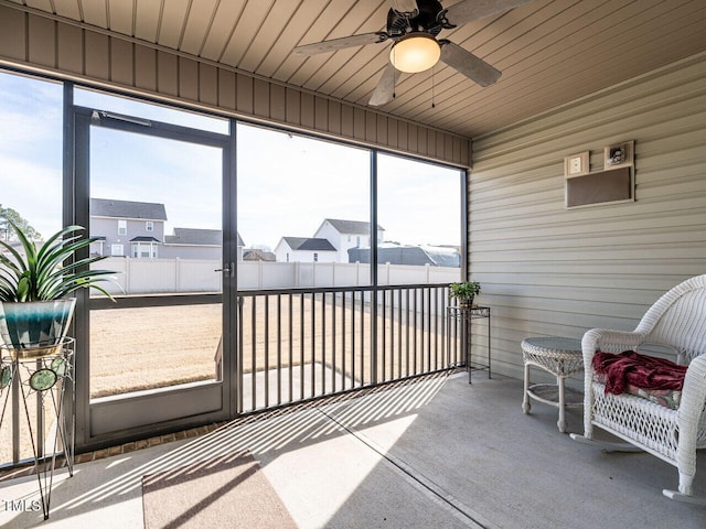 sunroom / solarium with ceiling fan