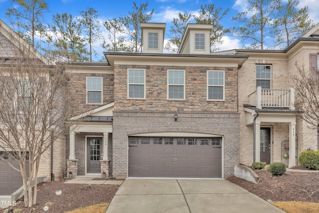 view of front of home with brick siding, driveway, and an attached garage