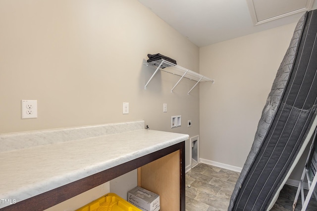 laundry area featuring laundry area, washer hookup, electric dryer hookup, and baseboards