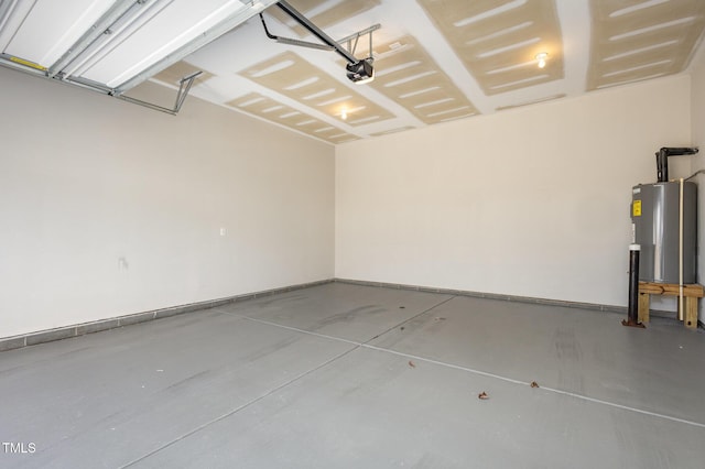 garage featuring a garage door opener, electric water heater, and baseboards