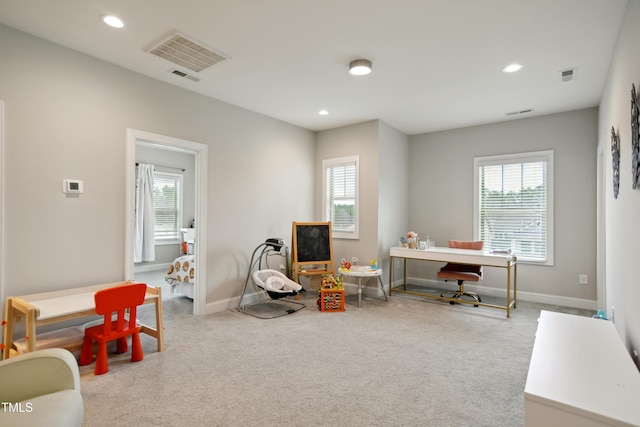 office space featuring recessed lighting, visible vents, and a healthy amount of sunlight