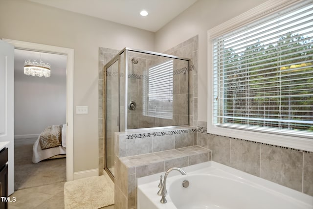 bathroom featuring a garden tub, tile patterned flooring, a shower stall, and vanity