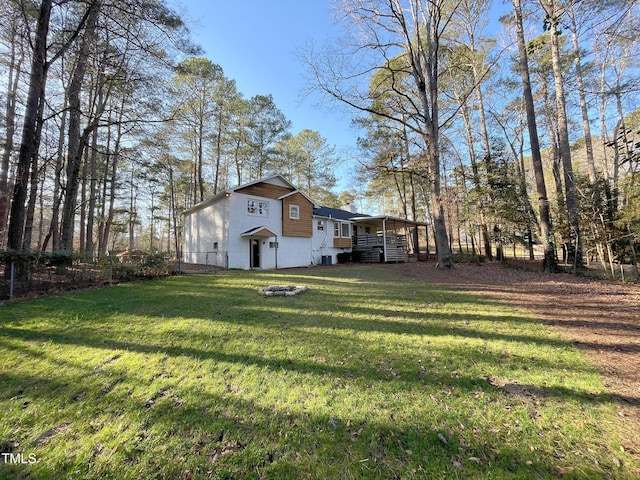 view of yard with an outdoor fire pit