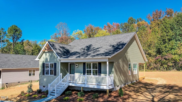 view of front of house with a porch, crawl space, and a shingled roof