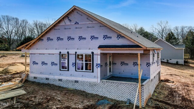 view of side of home with crawl space