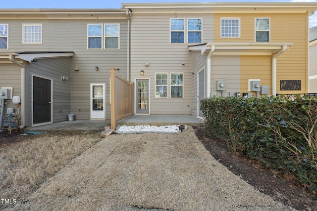 back of house with a patio