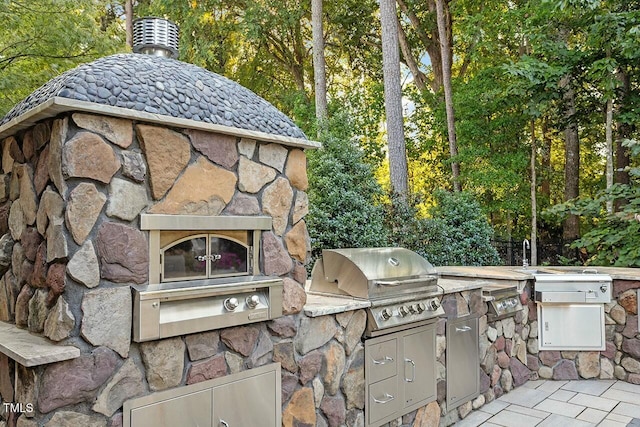 view of patio with a grill and area for grilling