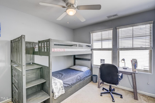 bedroom featuring visible vents, a ceiling fan, baseboards, and carpet floors