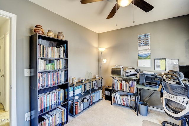 carpeted office with ceiling fan