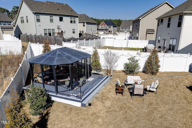 exterior space with a patio area, a residential view, a lawn, and a fenced backyard