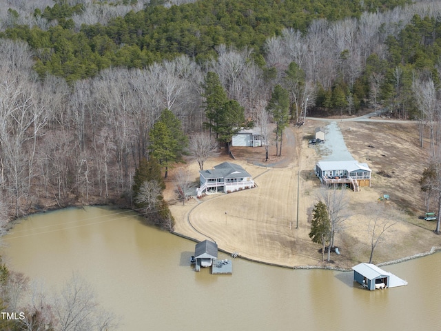 aerial view featuring a water view and a view of trees