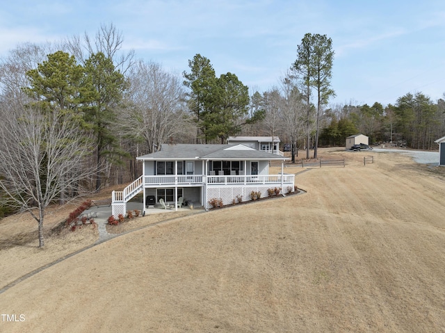 view of front of house with covered porch and driveway