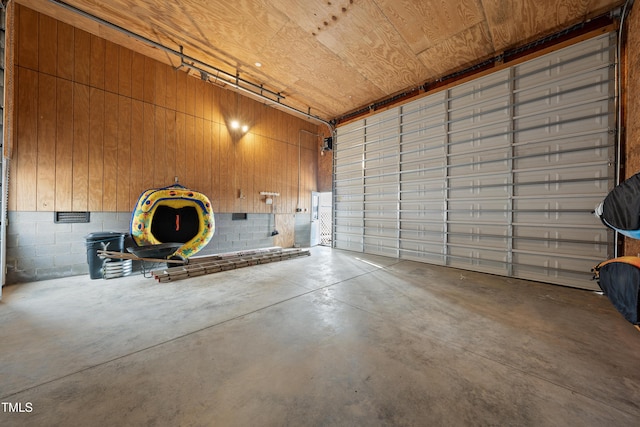 garage featuring concrete block wall