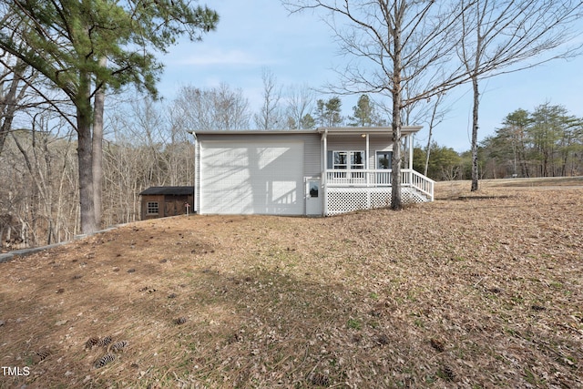 view of outbuilding featuring a porch