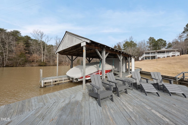 view of dock featuring a water view and boat lift