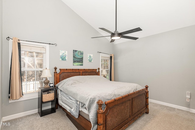 bedroom featuring light carpet, high vaulted ceiling, ceiling fan, and baseboards