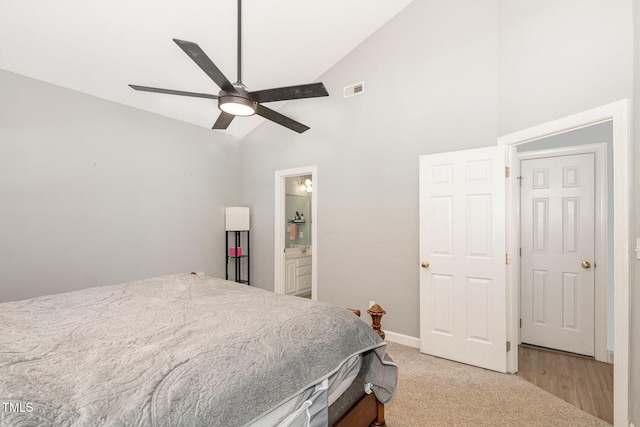 bedroom with high vaulted ceiling, connected bathroom, visible vents, a ceiling fan, and baseboards