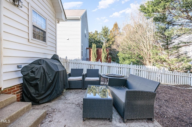 view of patio featuring fence, an outdoor living space, and area for grilling