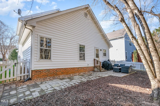 rear view of property featuring entry steps, a patio, and fence