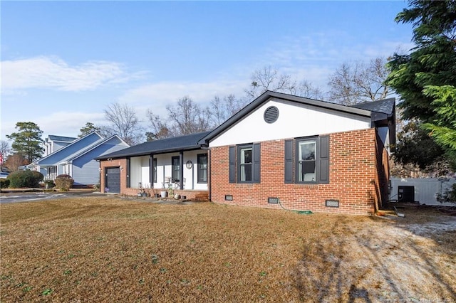 ranch-style house with aphalt driveway, brick siding, an attached garage, a front yard, and crawl space