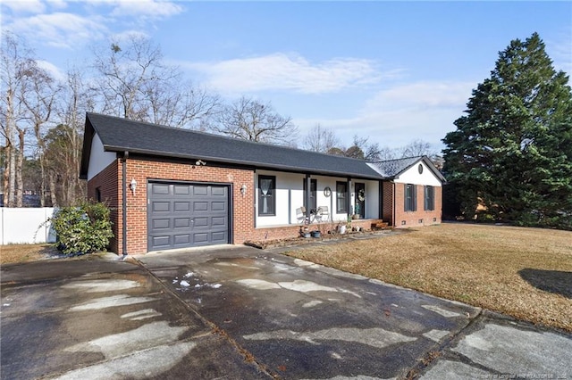 single story home with brick siding, fence, a garage, driveway, and a front lawn