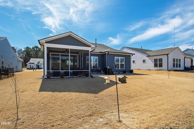 back of property featuring a sunroom