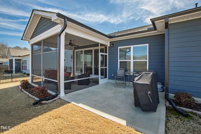 view of patio featuring a sunroom and fence