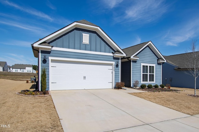 view of front of property with a garage, concrete driveway, board and batten siding, and roof with shingles