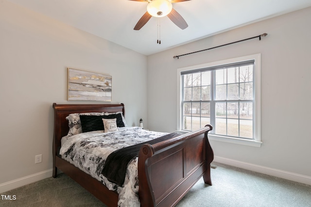 carpeted bedroom with baseboards and a ceiling fan